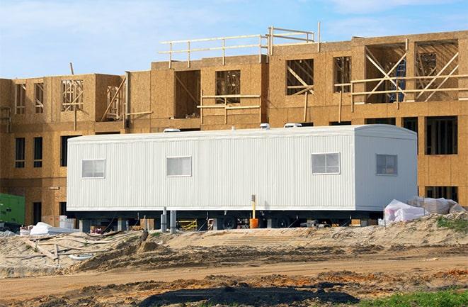 construction workers discussing plans in a rental office in Bayou Vista, TX